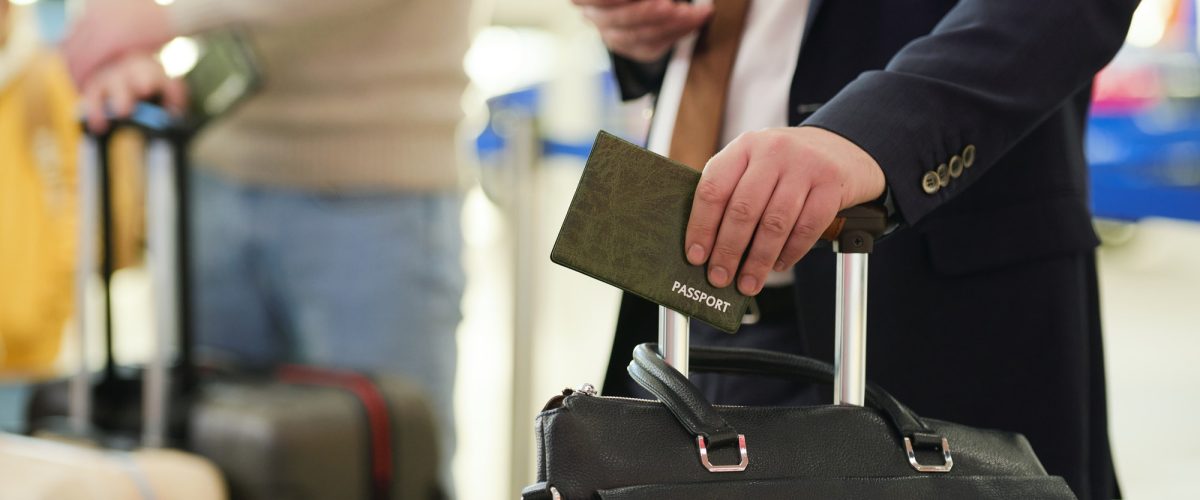 man-with-documents-at-airport